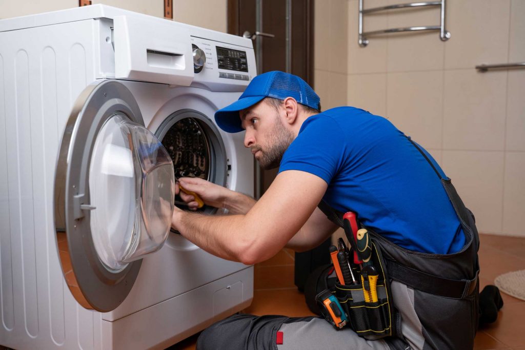 a technician repairing a washer and dryer repair Pittsburgh